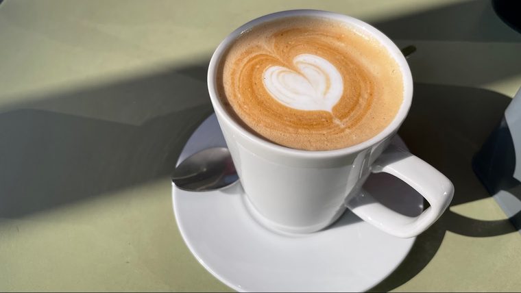 A flat white with tulip latte art